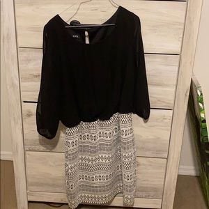 Cute dress. Is more fitting around the waist